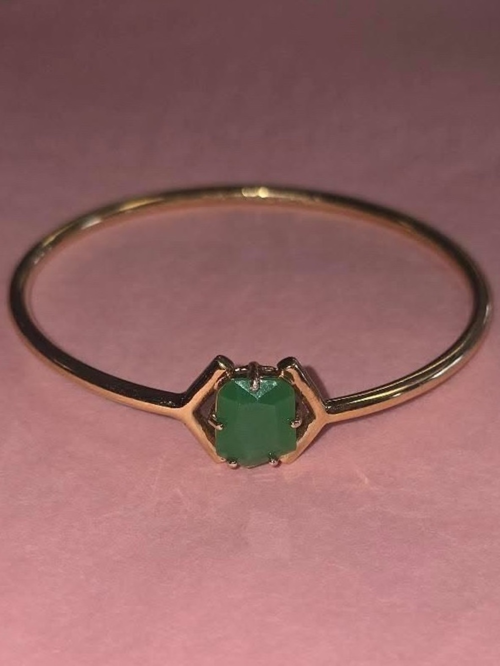 Gold Kate Spade bracelet with green gem stone